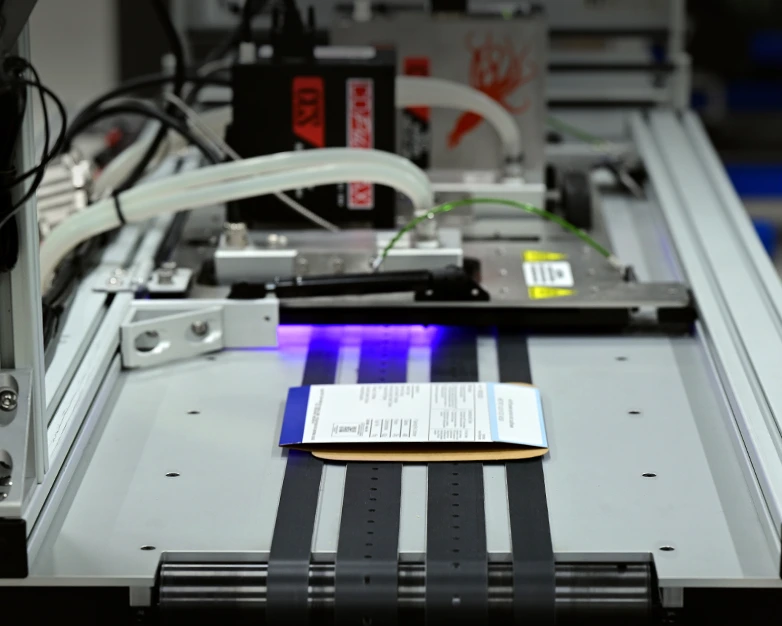 Engineer configuring a custom marking and labeling automation system